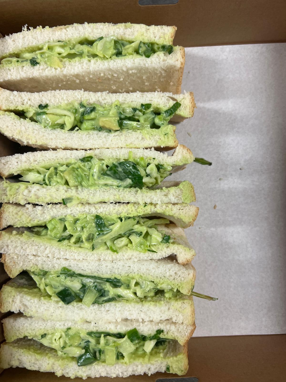 Green goodness sandwiches packed neatly in an Everston Catering box.